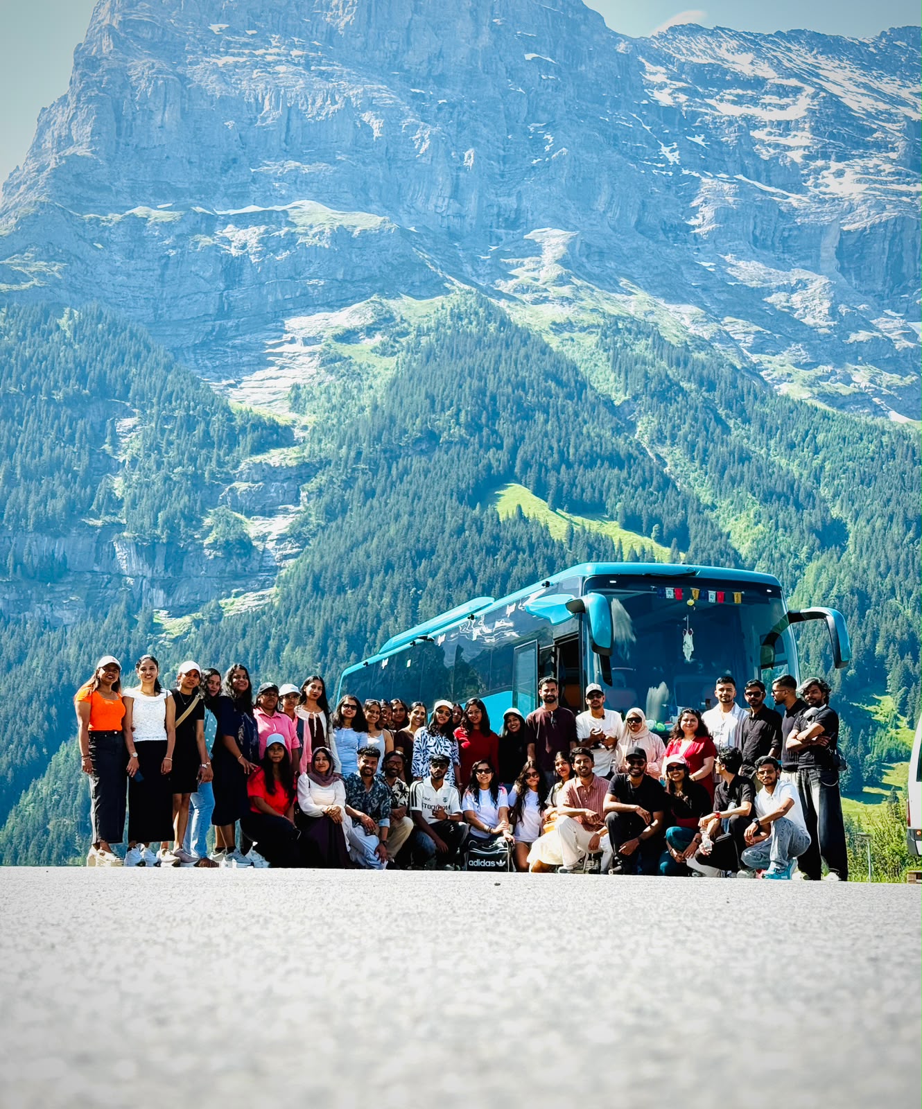 Group photo beneath the Eiger mountain in Grindelwald