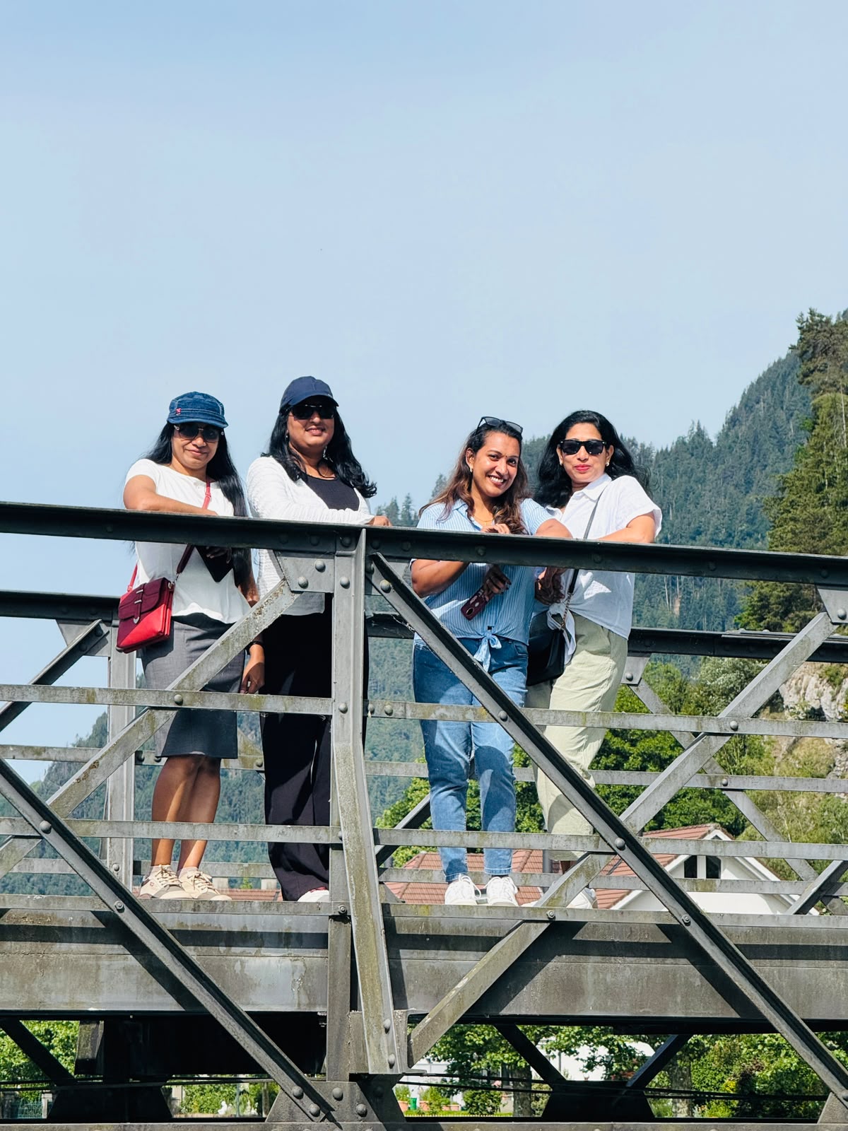 Travellers posing on a bridge in Interlaken, Switzerland